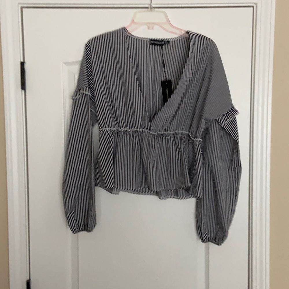 Ruffle detail deep V flair shirt!